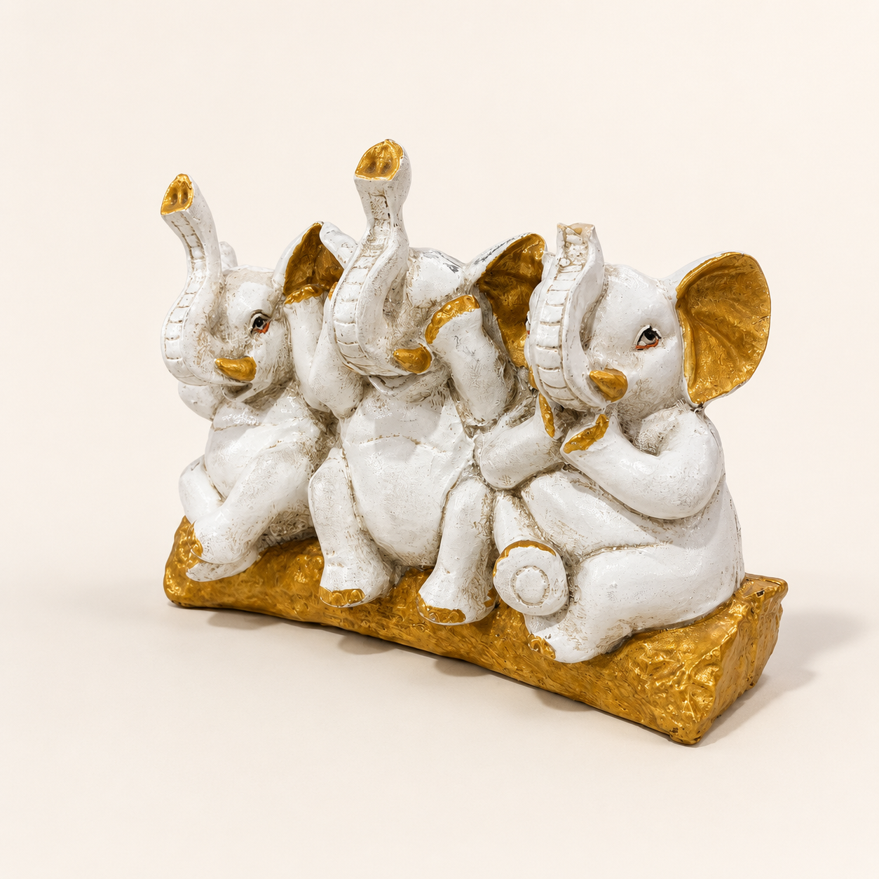 Three Wise Elephants ivory and gold decorative sculpture, right angled view