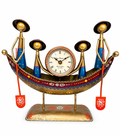 Hand-painted tribal boat table clock with four figures, front view