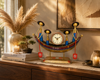 Hand-painted tribal boat table clock styled on a wooden console