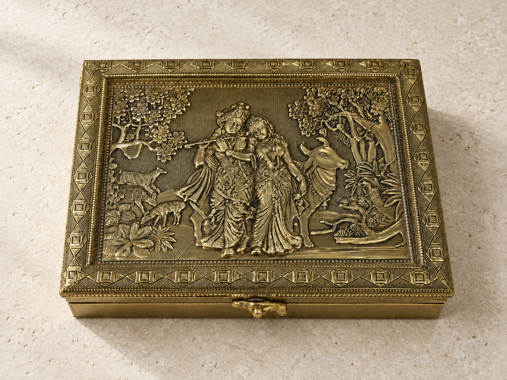 Radha Krishna relief jewellery organiser box displayed on ivory limestone