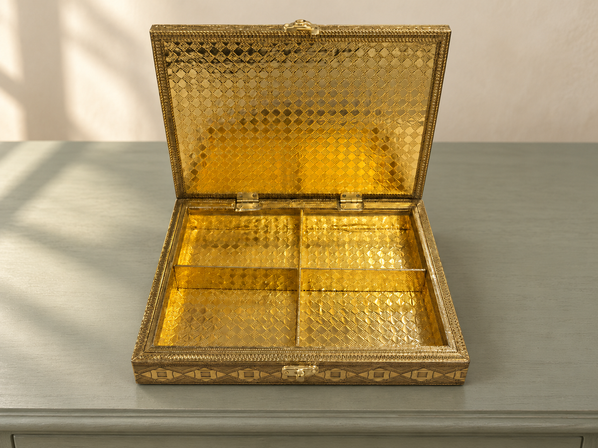 Open four-compartment Vrindavan jewellery organiser box on a pale green tabletop