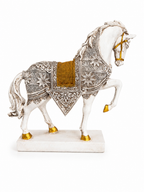 Opposite side view of the ornate white and gold horse sculpture